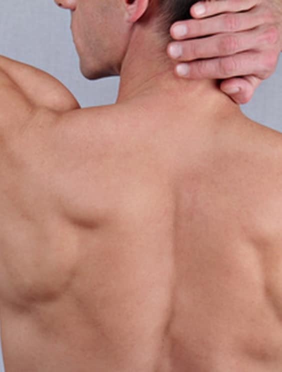 Male Waxing. Muscular male body hair removal close up.
